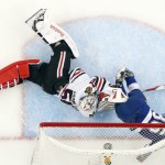 Tampa Bay Lightning right wing Nikita Kucherov (86) hits the goal post as he collides with Chicago Blackhawks goalie Corey Crawford (50) during the first period of Game 5 of the NHL hockey Stanley Cup Final, Saturday, June 13, 2015, in Tampa, Fla. (AP Photo/Chris O'Meara)