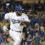 Los Angeles Dodgers' Howie Kendrick runs to first base after hitting a two-run single during the seventh inning of a baseball game against the Arizona Diamondbacks, Tuesday, June 9, 2015, in Los Angeles. (AP Photo/Jae C. Hong)