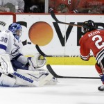 Chicago Blackhawks' Duncan Keith, right, scores past Tampa Bay Lightning goalie Ben Bishop during the second period in Game 6 of the NHL hockey Stanley Cup Final Monday, June 15, 2015, in Chicago. (AP Photo/Charles Rex Arbogast)
