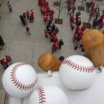 Fans line up to enter Great American Ball Park before the start of the Cincinnati Reds and Pittsburgh Pirates opening day baseball game on Monday, April 6, 2015, in Cincinnati. (AP Photo/Gary Landers)