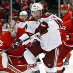 Arizona Coyotes right wing Shane Doan (19) chases the puck against the Detroit Red Wings during the first period of an NHL hockey game in Detroit on Tuesday, March 24, 2015. (AP Photo/Paul Sancya)
