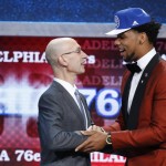 Jahlil Okafor, right, is greeted by NBA Commissioner Adam Silver after being selected third overall by the Philadelphia 76ers during the NBA basketball draft, Thursday, June 25, 2015, in New York. (AP Photo/Kathy Willens)
