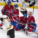 Montreal Canadiens, from left, Douglas Murray, Lars Eller, Mike Weaver and goalie Carey Price react as Boston Bruins' Carl Soderberg celebrates the game winning goal by teammate Matt Fraser during the first period overtime in Game 4 in the second round of the NHL Stanley Cup playoffs Thursday, May 8, 2014, in Montreal. (AP Photo/The Canadian Press, Paul Chiasson)
