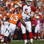 Arizona Cardinals quarterback Drew Stanton (5) throws under pressure from Denver Broncos strong safety T.J. Ward (43) during the first half of an NFL football game, Sunday, Oct. 5, 2014, in Denver. (AP Photo/Jack Dempsey)