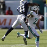 San Diego Chargers wide receiver Eddie Royal (11) interferes with a pass intended for Miami Dolphins strong safety Jimmy Wilson (27) during the first half of an NFL football game, Sunday, Nov. 2, 2014, in Miami Gardens, Fla. (AP Photo/Alan Diaz)