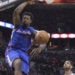 Los Angeles Clippers' DeAndre Jordan (6) scores over San Antonio Spurs' Tim Duncan, right, during the first half of Game 6 in an NBA basketball first-round playoff series, Thursday, April 30, 2015, in San Antonio. (AP Photo/Darren Abate)