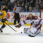 Buffalo Sabres' Mikhail Grigorenko (25), of Russia, backhands a shot against Arizona Coyotes' Mike Smith (41) during the first period of an NHL hockey game Thursday, March 26, 2015, in Buffalo, N.Y. (AP Photo/Gary Wiepert)