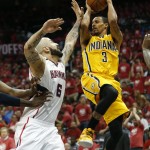  Indiana Pacers guard George Hill (3) passes as Atlanta Hawks center Pero Antic (6) defends in the first half of Game 6 of a first-round NBA basketball playoff series in Atlanta, Thursday, May 1, 2014. (AP Photo/John Bazemore)