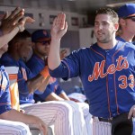 New York Mets' Matt Harvey (33) celebrates in the dugout after hitting a two-run home run during the fifth inning of a baseball game against the Arizona Diamondbacks, Saturday, July 11, 2015, at Citi Field in New York. (AP Photo/Bill Kostroun)
