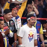 Manny Pacquiao, from the Philippines, enters the ring before his welterweight title fight against Floyd Mayweather Jr., on Saturday, May 2, 2015 in Las Vegas. (AP Photo/Eric Jamison)