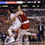 Duke's Jahlil Okafor (15) is fouled by Wisconsin's Frank Kaminsky (44) during the second half of the NCAA Final Four college basketball tournament championship game Monday, April 6, 2015, in Indianapolis. (AP Photo/David J. Phillip)