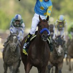 Victor Espinoza rides American Pharoah to victory in the141st running of the Kentucky Derby horse race at Churchill Downs Saturday, May 2, 2015, in Louisville, Ky. (AP Photo/Darron Cummings)