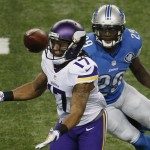 Minnesota Vikings wide receiver Jarius Wright (17) bobbles the ball while defended by Detroit Lions cornerback Cassius Vaughn (29) during the first half of an NFL football game at Ford Field in Detroit, Sunday, Dec. 14, 2014. (AP Photo/Paul Sancya)