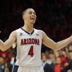Arizona guard T.J. McConnell (4) celebrates after defeating Gonzaga 66-63 in overtime during an NCAA college basketball game, Saturday, Dec. 6, 2014, in Tucson, Ariz. (AP Photo/Rick Scuteri)