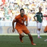  Netherlands' Klaas-Jan Huntelaar celebrates after scoring his side's second goal during the World Cup round of 16 soccer match between the Netherlands and Mexico at the Arena Castelao in Fortaleza, Brazil, Sunday, June 29, 2014. The Netherlands won the match 2-1. (AP Photo/Natacha Pisarenko)