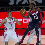 United States's Kyrie Irving, right, goes for the basket in front Turkey's Baris Hersek, left, during the Group C Basketball World Cup match, in Bilbao northern Spain, Sunday, Aug. 31, 2014. The 2014 Basketball World Cup competition take place in various cities in Spain from last Aug. 30 through to Sept. 14. (AP Photo/Alvaro Barrientos)
