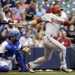Arizona Diamondbacks' David Peralta watches his RBI double during the first inning of a baseball game against the Milwaukee Brewers Friday, May 29, 2015, in Milwaukee. (AP Photo/Morry Gash)