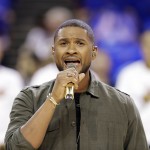 Usher performs the national anthem prior during the first half of Game 4 of basketball's NBA Finals between the Cleveland Cavaliers and the Golden State Warriors in Cleveland, Thursday, June 11, 2015. (AP Photo/Tony Dejak)