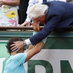 Spain's Rafael Nadal is congratulated by six-time winner Bjorn Borg of Sweden, right, after winning the final of the French Open tennis tournament against Serbia's Novak Djokovic at the Roland Garros stadium, in Paris, France, Sunday, June 8, 2014. Nadal won in four sets 3-6, 7-5, 6-2, 6-4. (AP Photo/Darko Vojinovic)