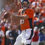 Denver Broncos quarterback Peyton Manning (18) throws his 500th career touchdown pass during the first half of an NFL football game against the Arizona Cardinals, Sunday, Oct. 5, 2014, in Denver. (AP Photo/Joe Mahoney)