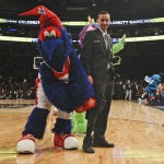 The Washington Wizards' mascot pulls the pant leg of a Madison Square Garden security guard during a break in the second half of the NBA All-Star celebrity basketball game Friday, Feb. 13, 2015, in New York. (AP Photo/Frank Franklin II)