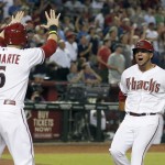 Arizona Diamondbacks' Ender Inciarte (5) and David Peralta, right, celebrate their runs scored against the Detroit Tigers during the eighth inning of a baseball game on Tuesday, July 22, 2014, in Phoenix. The Diamondbacks won 5-4. (AP Photo)