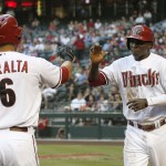  Arizona Diamondbacks' Didi Gregorius, right, gets a high-five from teammate David Peralta (6) after Gregorius scored a run against the Milwaukee Brewers during the first inning of a baseball game on Tuesday, June 17, 2014, in Phoenix. (AP Photo/Ross D. Franklin)