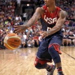 United States' Derrick Rose, of the Chicago Bulls, passes during the first half of an exhibition basketball game against Brazil, Saturday, Aug. 16, 2014, in Chicago. (AP Photo/Charles Rex Arbogast)