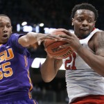 North Carolina State's Beejay Anya (21) holds the ball as LSU's Tim Quarterman (55) tries to get it during the first half of an NCAA tournament second round college basketball game, Thursday, March 19, 2015, in Pittsburgh. (AP Photo/Gene J. Puskar)