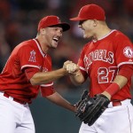 Los Angeles Angels relief pitcher Huston Street, left, celebrates with Mike Trout after the Angels defeated the Arizona Diamondbacks 4-1 in a baseball game in Anaheim, Calif., Tuesday, June 16, 2015. (AP Photo/Alex Gallardo)
