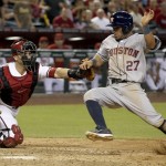  Arizona Diamondbacks' Miguel Montero, left, tags Houston Astros' Jose Altuve (27) out at home plate during the ninth inning of a baseball game on Monday, June 9, 2014, in Phoenix. The Astros won 4-3. (AP Photo/Ross D. Franklin)