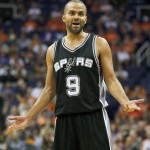 San Antonio Spurs guard Tony Parker (9) reacts to a call in the second quarter during an NBA basketball game against the Phoenix Suns, Friday, Oct. 31, 2014, in Phoenix. (AP Photo/Rick Scuteri)