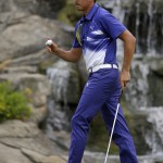 Rickie Fowler reacts after making a birdie on the 13th hole during the third round of the PGA Championship golf tournament at Valhalla Golf Club on Saturday, Aug. 9, 2014, in Louisville, Ky. (AP Photo/John Locher)
