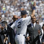  From left, former Yankees first baseman Tino Martinez, former relief pitcher Mariano Rivera and former catcher Jorge Posada, right, applaud New York Yankees shortstop Derek Jeter (2), during a pregame ceremony honoring the Yankees captain who is retiring at the end of the season, on Derek Jeter Day at Yankee Stadium in New York, Sunday, Sept. 7, 2014. game (AP Photo/Kathy Willens)