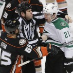Dallas Stars' Antoine Roussel(21), of France, intimidates Anaheim Ducks' Emerson Etem(65) during the second period of Game 5 of the first-round NHL hockey Stanley Cup playoff series on Friday, April 25, 2014, in Anaheim, Calif. (AP Photo/Jae C. Hong)