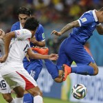 Greece's Jose Holebas, right, tries to control the ball during the World Cup round of 16 soccer match between Costa Rica and Greece at the Arena Pernambuco in Recife, Brazil, Sunday, June 29, 2014. (AP Photo/Andrew Medichini)