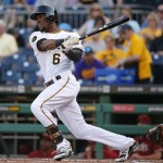 Pittsburgh Pirates' Starling Marte (6) singles off Arizona Diamondbacks starting pitcher Chase Anderson to drive in Gregory Polanco from third base during the first inning of a baseball game in Pittsburgh, Wednesday, July 2, 2014. (AP Photo/Gene J. Puskar)
