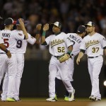 American League players celebrate after their 5-3 victory over the National League in the MLB All-Star baseball game, Tuesday, July 15, 2014, in Minneapolis. (AP Photo/Jeff Roberson)