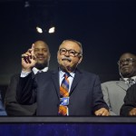 NFL Hall of Famer Dick Butkus acknowledges fans as he stands with former NFL players during the second round of the 2015 NFL Football Draft, Friday, May 1, 2015, in Chicago. (AP Photo/Charles Rex Arbogast)