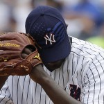 Wearing a special baseball cap to commemorate the Fourth of July, New York Yankees pitcher Michael Pineda prepares to pitch against the Tampa Bay Rays during the second inning of a baseball game, Saturday, July 4, 2015, in New York. (AP Photo/Julie Jacobson)
