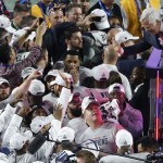 New England Patriots owner Robert Kraft, top right, greets players after the second half of NFL Super Bowl XLIX football game against the Seattle Seahawks Sunday, Feb. 1, 2015, in Glendale, Ariz. The New England Patriots won 28-24. (AP Photo/Ross D. Franklin)