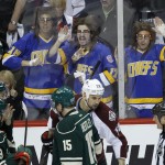  Fans dressed as the Hanson Brothers from the movie Slap Shot yell at players and referees as Minnesota Wild defenseman Clayton Stoner and Colorado Avalanche center Brad Malone are assessed penalties during the first period of Game 3 of an NHL hockey first-round playoff series in St. Paul, Minn., Monday, April 21, 2014. The Wild won 1-0. (AP Photo/Ann Heisenfelt)