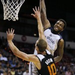 New Orleans Pelicans' Victor Rudd attempts to dunk over Phoenix Suns' Alec Brown during the first half of an NBA summer league basketball game Sunday, July 19, 2015, in Las Vegas. (AP Photo/John Locher)
