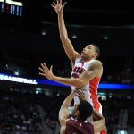 Arizona forward Brandon Ashley, right, shoots over Texas Southern forward Malcolm Riley during the first half of an NCAA college basketball tournament second round game in Portland, Ore., Thursday, March 19, 2015. (AP Photo/Greg Wahl-Stephens)