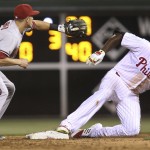 Philadelphia Phillies' Ryan Howard is safe at second on an RBI double as Arizona Diamondbacks shortstop Nick Ahmed waits for the ball during the sixth inning of a baseball game against the Arizona Diamondbacks, Friday, May 15, 2015, in Philadelphia. The Phillies won 4-3. (AP Photo/Laurence Kesterson)