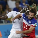 Ghana's Mohammed Rabiu, left, and United States' Kyle Beckerman struggle with each other to head the ball during the group G World Cup soccer match between Ghana and the United States at the Arena das Dunas in Natal, Brazil, Monday, June 16, 2014. (AP Photo/Petr David Josek)