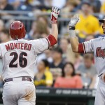  Arizona Diamondbacks' Miguel Montero (26) is greeted by on deck batter David Peralta after he scored the Diamondbacks second run in the fifth inning of the baseball game against the Pittsburgh Pirates on Tuesday, July 1, 2014, in Pittsburgh. (AP Photo/Keith Srakocic)