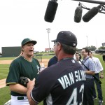 Actor Will Ferrell, left, talks with Seattle Mariners first base coach Andy Van Slyke before Ferrell played in a spring training baseball game, Thursday, March 12, 2015, in Mesa, Ariz. (AP Photo/Matt York)