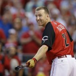 National League's Todd Frazier, of the Cincinnati Reds, smiles as he hits during the MLB All-Star baseball Home Run Derby, Monday, July 13, 2015, in Cincinnati. (AP Photo/John Minchillo)