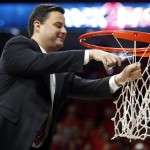 Arizona head coach Sean Miller cuts down part of the net after defeating Stanford 91-69 and winning the Pac-12 conference after an NCAA college basketball game, Saturday, March 7, 2015, in Tucson, Ariz. (AP Photo/Rick Scuteri)